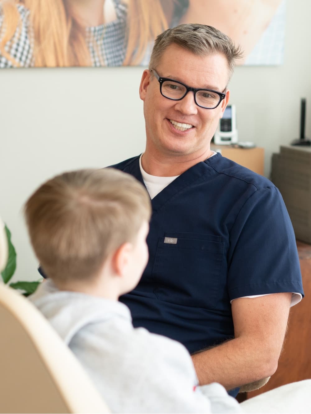 Dr. Grossman and patient smiling during visit